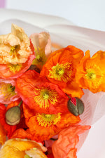 Hand-tied bright poppies featuring signature wrap Brisbane Market Flowers florist