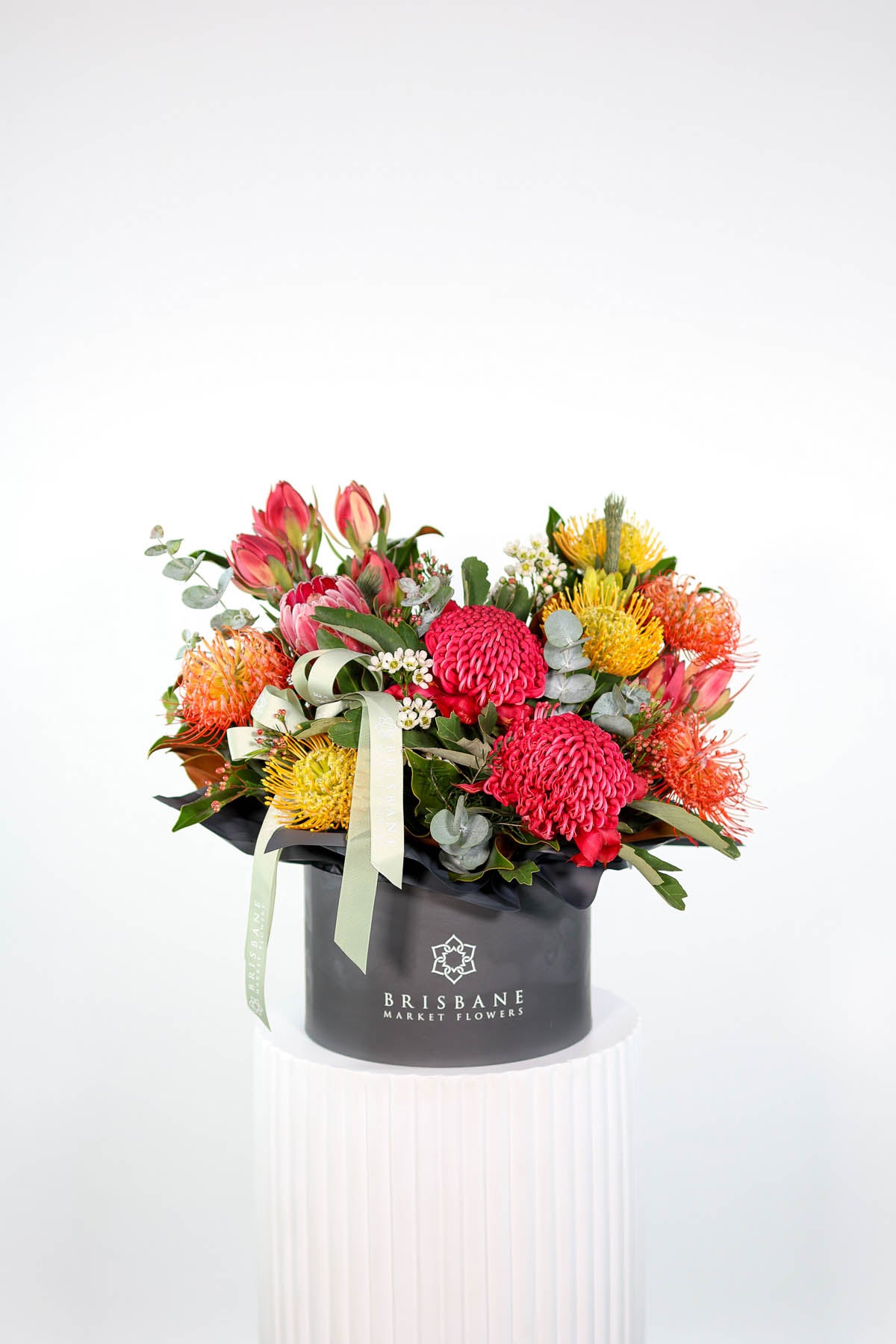 Hand-crafted Keppel hatbox of Australian and South African natives, ready for same-day Brisbane delivery