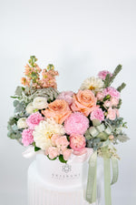 Milan luxury pastel arrangement featuring blush, peach, and champagne roses with soft in white Brisbane Market Flowers hatbox