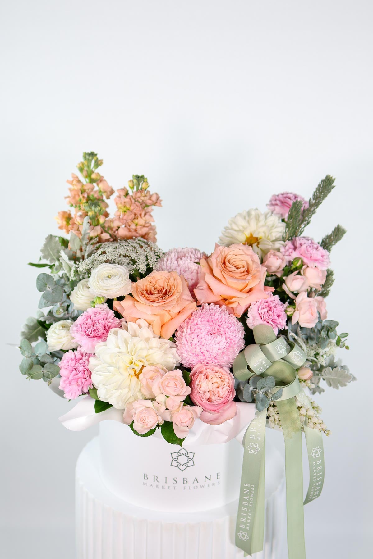 Milan luxury pastel arrangement featuring blush, peach, and champagne roses with soft in white Brisbane Market Flowers hatbox