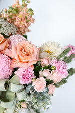 feminine, lush, and full design style Luxury pastel hatbox flower arrangement