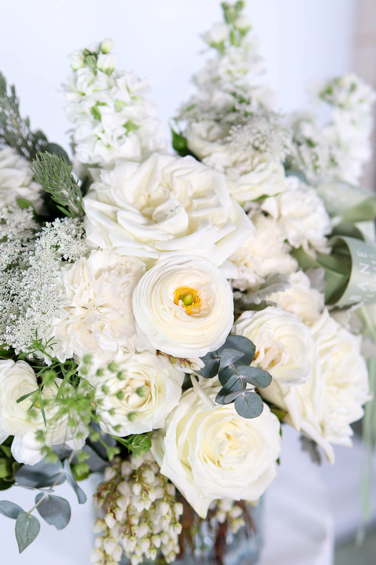 Hand-crafted white flower arrangement with Queen Anne’s lace, woolly bush, and ivory roses – Brisbane florist