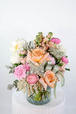 Luxury vase arrangement in pink & peach hues tied with BMF green ribbon & chiffon bow