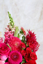 Bouquet of red and pink dahlia flowers.