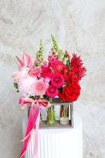 Stylish Valentine’s flower arrangement in three mini vases Brisbane.