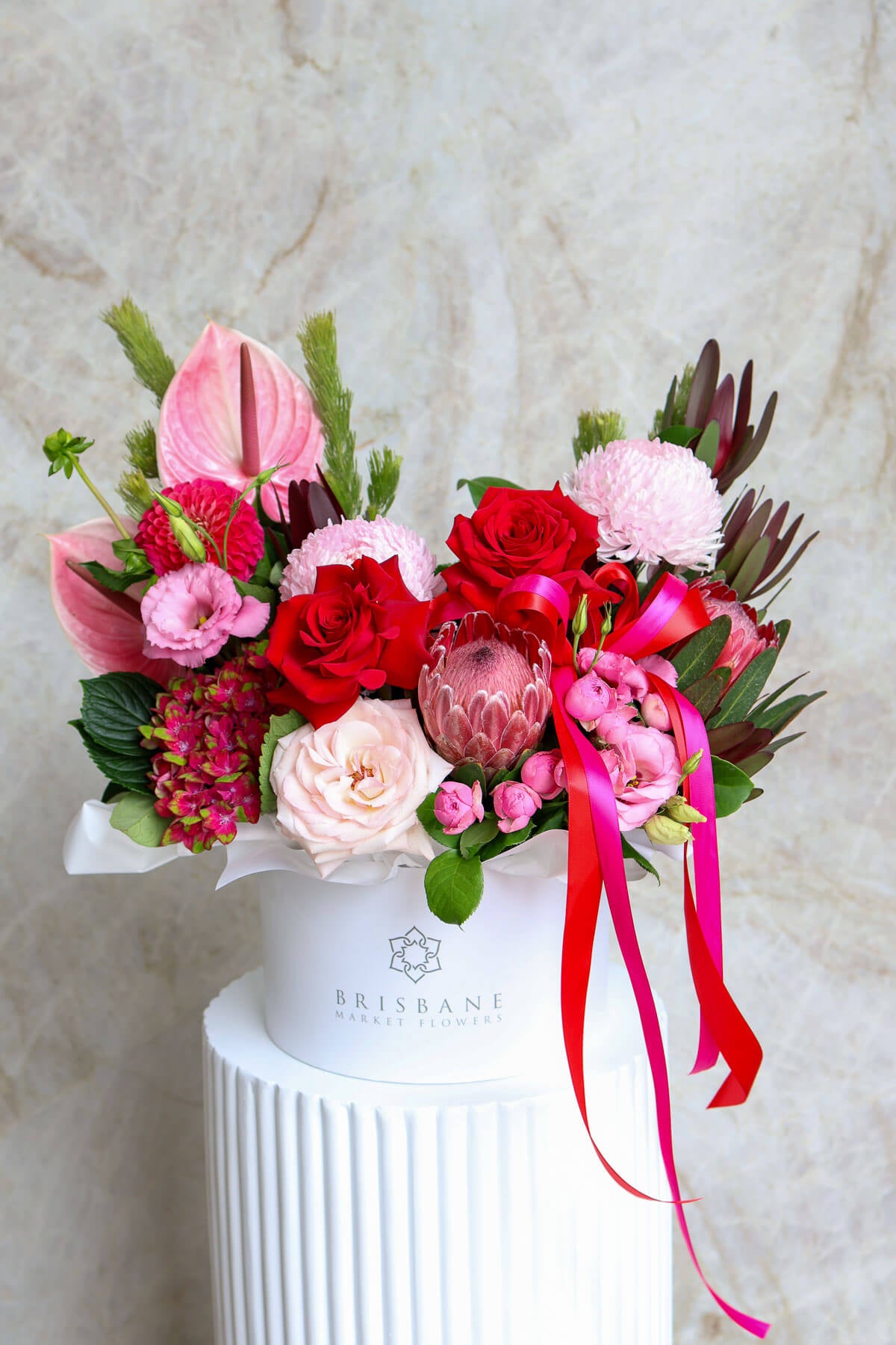 Romantic Valentine’s flowers Brisbane featuring roses protea and anthuriums.