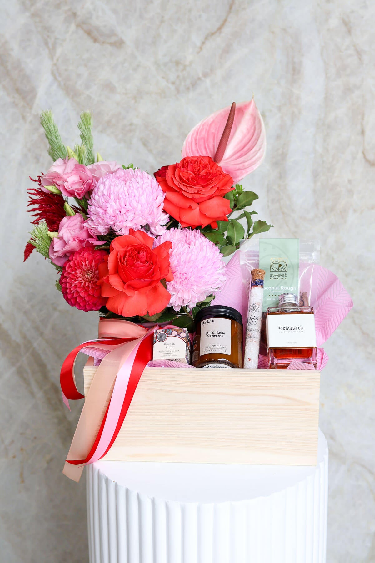 Luxe Love Valentine’s hamper with flowers chocolates and pamper gifts.