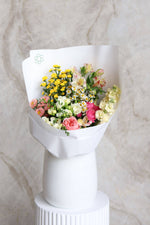 White wrapped Easter flower bundle