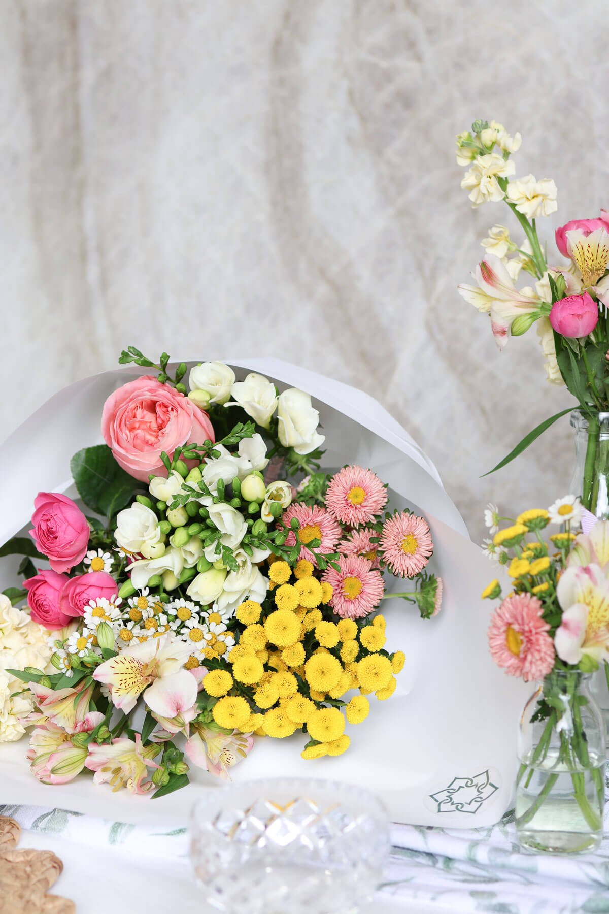 Chamomile and freesia Easter table centrepiece
