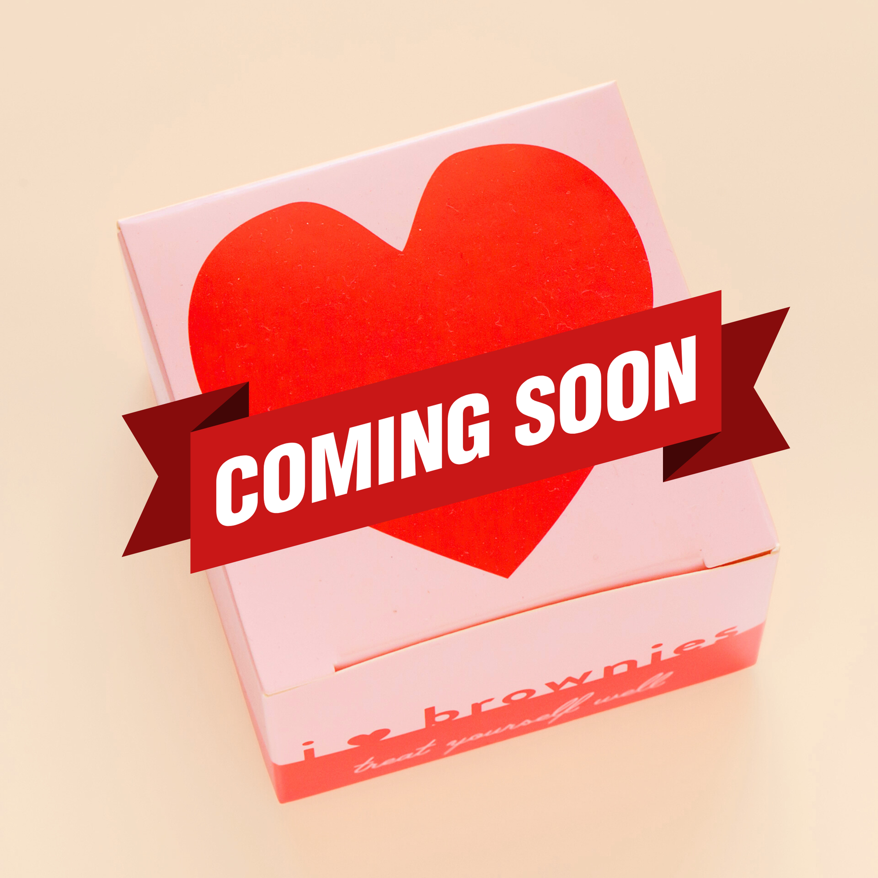 Pink box with red heart with Chocolate Brownie inside.