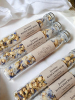 Jasmine bath and foot soaks in clear tubes with visible ingredients.