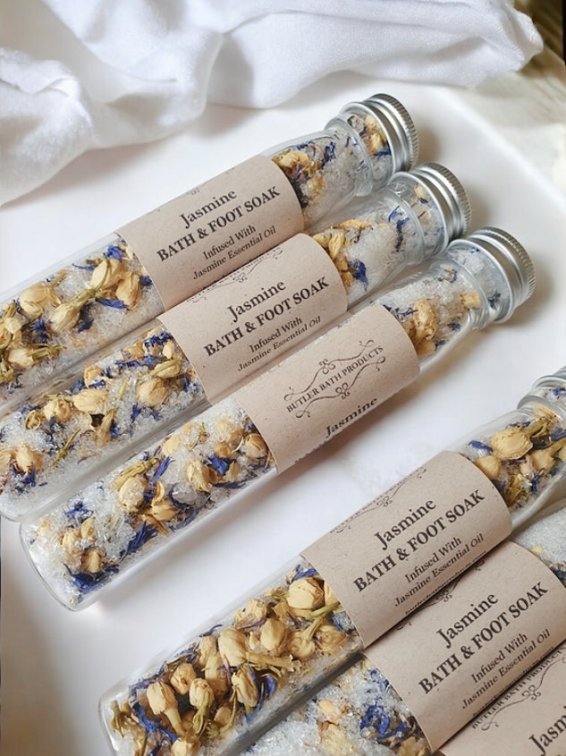 Jasmine bath and foot soaks in clear tubes with visible ingredients.
