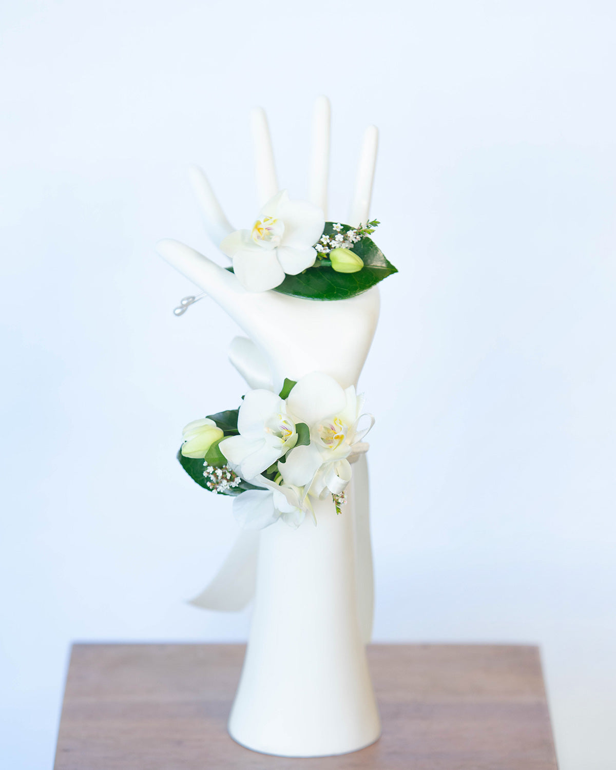 Wrist corsage and buttonhole set featuring Orchids from Brisbane Market Flowers.