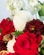Eve Christmas Hatbox arrangement featuring red roses, white disbuds & festive greenery – Brisbane Market Flowers