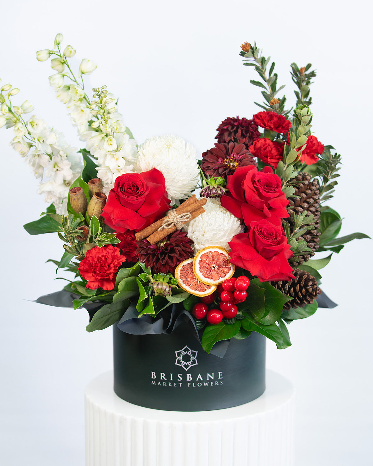 Festive and modern flower hatbox centerpiece with red roses & white flowers – Christmas design Brisbane Market Flowers
