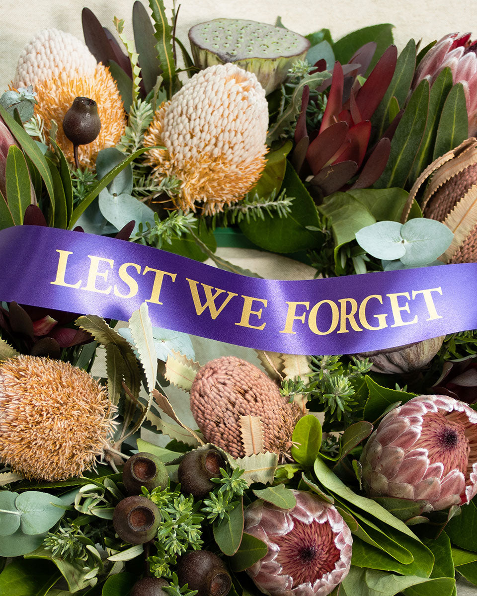 Native flower wreath with a purple lest we forget ribbon in Brisbane.